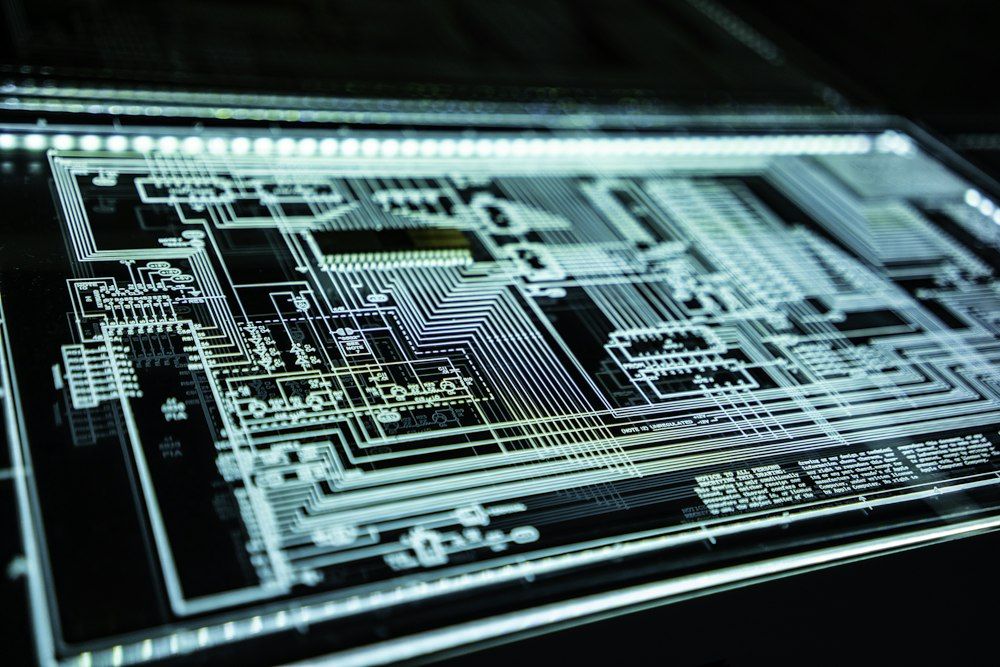 Close-up of a glowing circuit board — the hardware layer of cybersecurity